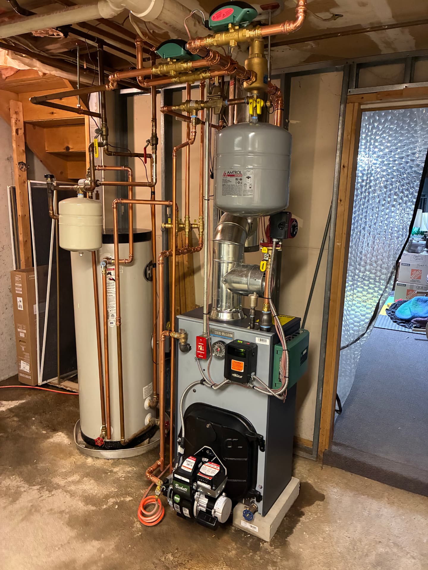 Water heater and boiler installed with professional copper piping by Top Shelf Plumbing & Heating